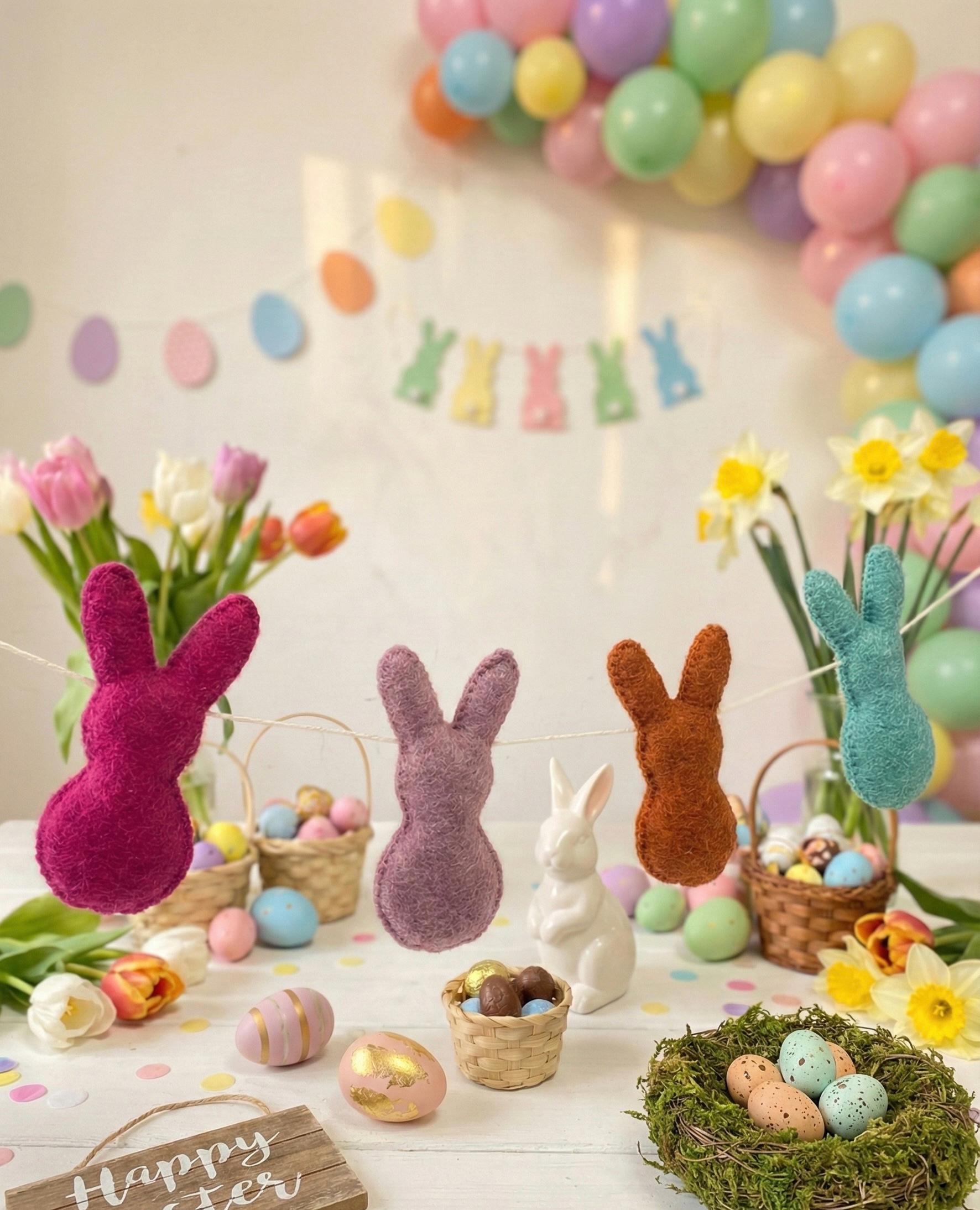 Easter-themed decor with colorful balloons, bunny decorations, and Easter eggs.