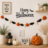 Halloween-themed decorations including pumpkins, a lantern, and 'Happy Halloween' banner on a wall.