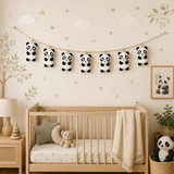 Nursery room with wooden crib, panda decorations, and wall art.
