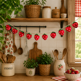 Kitchen with strawberry-themed decorations and utensils